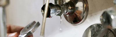 Woman inspector with laptop inspecting a home construction site