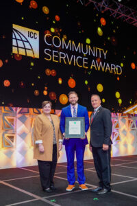 Pictured is Daugherty (center) as he receives the 2022 ICC Community Service Award from ICC Awards Committee Chair Steve McDaniel (right) and President of the International Code Council Board of Directors Cindy Davis (left) during the Awards Luncehon in Louisville, Kentucky.