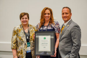 Pictured is Kelly Janis as she accepts the 2022 ICC Trailblazer Award from Code Council Awards Committee Chair Steve McDaniel during the Emerging Leaders Membership Council Meeting on Wednesday, Sept. 14, 2022, in Louisville, Kentucky.