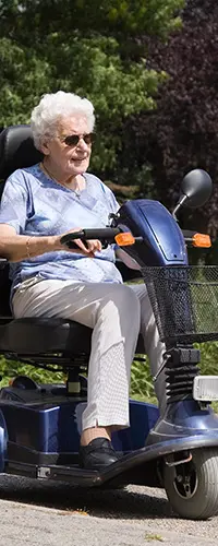 eldery woman on sit down scooter