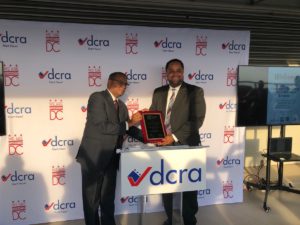 IAS President Raj Nathan (left) presents the plaque to City Administrator Rashad Young.