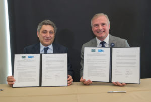 Antonino Occhiuzzi (left), head of the Italian Institute for the Technologies of Construction, and Dominic Sims (right), CBO, chief executive officer of the International Code Council, sign the Memorandum of Understanding.
