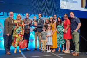 Pictured is Pfeiffer's family joining him on stage at the Code Council's 2022 Annual Conference.