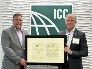 Code Council Chief Executive Officer Dominic Sims, CBO, and President of the Code Council Board of Directors, Michael Wich, signing the commemorative certificate of occupancy.