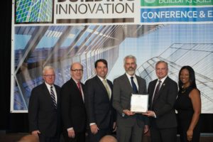 Sponsors of the Natural Hazard Mitigation Saves: 2017 Interim Report accept the Institute Honor Award from Institute Board Chairman Joseph Donovan (left) and Institute President Lakisha A. Woods (right). Pictured from left: Donovan; Robert Ivy, chief executive officer of The American Institute of Architects; Whitford E. Remer, counsel and director, public policy, Insurance Institute for Business and Home Safety; Seth Statler, director, government affairs, National Fire Protection Association; Dominic Sims, CBO, chief executive officer, International Code Council; and Woods. Photo: National Institute of Building Sciences
