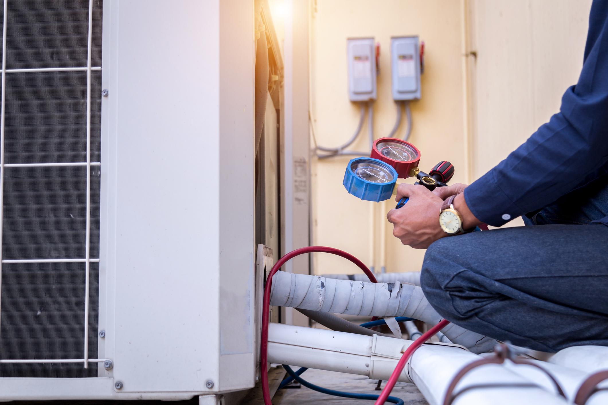Technician embracing HFC Phasedown by utilizing A2L Refrigerants
