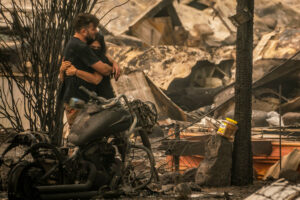 Shawn Thompson hugs Melissa Vuckovich at the location of where their home once stood in a in Ashland, Ore. Hundreds of homes in Ashland and nearby towns have been lost due to wildfire. Photo: David Ryder/Getty Images