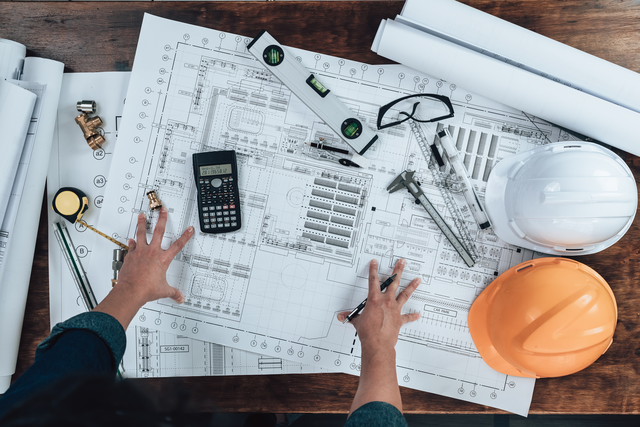 Building safety professional looking over building plans