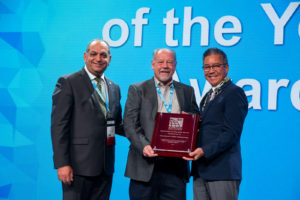2018 Educator of the Year Award recipient Steve Thomas (center), accepting on behalf of Colorado Code Consulting, with ICC Board Immediate Past President Jay Elbettar (left) and ICC Awards Committee Chair Stuart Tom (right)