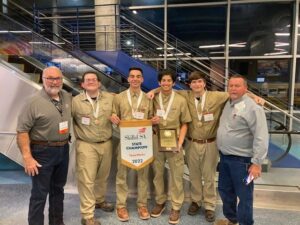 Bobby Horner (far left) with the state-winning team from Medina Valley High School and their instructor Steven Noll (far right).