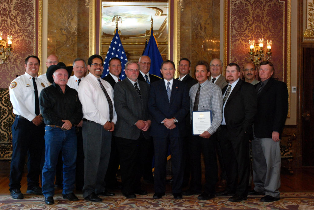 Jeff Whitney (front row, left) with International Code Council chapter representatives as Governor Gary Herbert declared Building Safety Month 2012 in Utah.