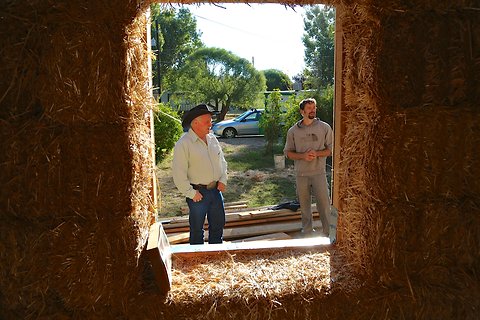 Jeff Whitney (left) and Eric Plourde, the instructor overseeing construction of a straw bale home, in Moab, Utah.
