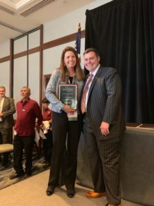 Susan Dowty receives the CALBO Industry Achievement Award from CALBO Executive Director Matt Wheeler.