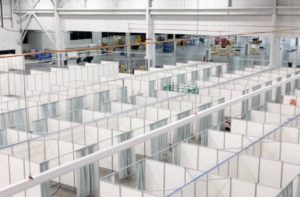 Rows of beds are constructed in a convention hall at Suburban Collection Showplace, which is being converted into a field hospital to treat coronavirus patients in Novi, Michigan.