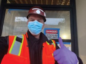 Construction professional wearing face mask