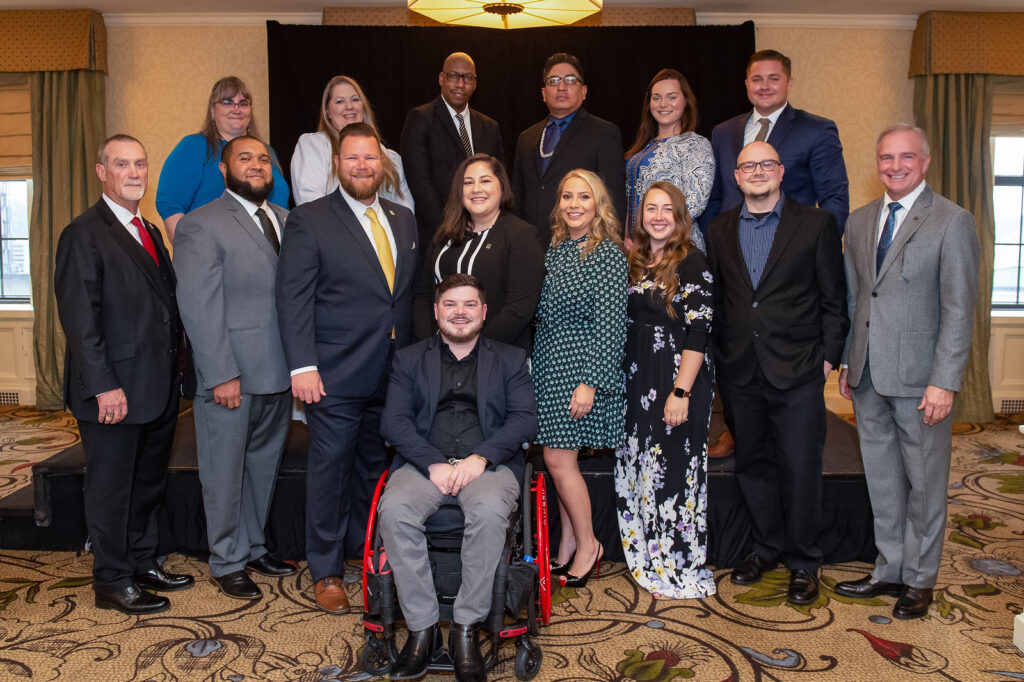The 2021 Board Shadows at the International Code Council Annual Conference in Pittsburgh, Pennsylvania. Pictured are (front center) Daniel Dabler, (front row from left) Code Council Board of Directors Immediate Past President Greg Wheeler, Greg Gilbert, Kevin Gore, Tela Gardner, Celine Sarkisloo, Jacinda Cheatham, Ed Green, Code Council Chief Executive Officer Dominic Sims, (back row from left) Serena Locke, Karen Courtney, Ayiende Toby, David Jackson, Lauren Wood, and Paul Messplay.