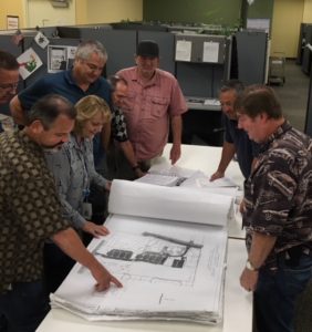 The Commercial Inspection Bullpen at Sacramento County Office of Development & Code Services Building Permits and Inspection Division. From left, Assistant Building Official Robin Rasmussen, Nancy Springer, and building inspectors Ed Reeves, Owen Metreyeon, Wayne Eastman, Mike Spencer, Larry Freese and Alan Caldwell.