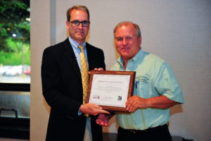 Village of Richton Park Building Commissioner Leo Hogan (right) receives an award from ICC Government Relations Senior Regional Manager Tim Schmitz (left) recognizing the village’s support of Building Safety Month.