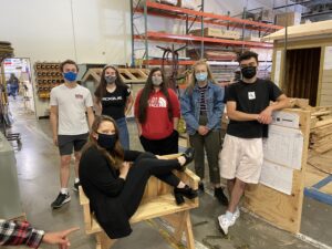 Alyssa Stone (second from left) with classmates Bryce, Annadelya, Ashely and Micah. CTEC Principal Rhonda Rhodes (front) sits on a bench the students constructed in a group activity.