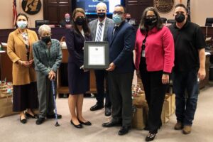 Pictured is Oscar Diaz (right of plaque), chief building official of the city of Modesto, with his team as he accepts the 2021 Innovation in Code Administration Award from Code Council Regional Manager Susan Dowty (left of plaque) during a special presentation on Wednesday, Nov. 10, 2021.