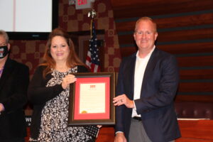 Carey Frazier is honored by Frisco Mayor Jeff Cheney and the City Council for 20 years of service to the city of Frisco and for her contributions to the city's success.