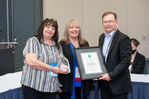 Pictured is Dana Stillwell (left), project expediter with the city of McKinney, and Jeff Harris (right), chief plans examiner with the city of McKinney, as they accept the 2021 ICC Trailblazer Award on behalf of Herzberger from ICC Awards Committee Chair Shirley Ellis (center) during the Emerging Leaders Membership Council meeting on Sunday, Sept. 19, 2021, in Pittsburgh, Pennsylvania.
