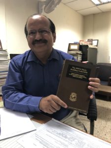 Sanjay Pant, head of Civil Engineering at the Bureau of Indian Standards, with a copy of the 1978 BOCA National Building Code that the Bureau referred to in the development of the Indian National Building Code.