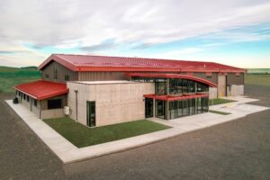 Sales, project management, field and office support of Halme Builders, Inc., have called this state-of-the-art building their home base since 2017. Located in Davenport, Wash., this building contains a beautiful reception area, six spacious offices, a lunchroom and a board room complete with the latest technology. The large shop provides easy access for equipment through three overhead rolling doors and the mezzanine above acts as a training area for field staff and shop storage. The pre-engineered metal building system for this building was designed and fabricated by Behlen Manufacturing, an IAS AC472 accredited company (IAS Certificate of Accreditation MB-102). The building was erected by Halme Builders Inc., an IAS accredited AC478 company (IAS Certificate of Accreditation MBA-106).