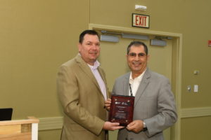 Osama Younan (right) receives the 2017 National Leadership in Sustainability and Energy Efficiency Award.