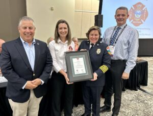 Angie Wiese receives the 2023 Excellence in Fire and Life Safety Award. 