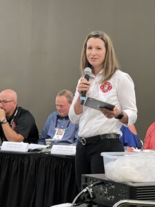 2023 Excellence in Fire and Life Safety Award winner, Angie Wiese addresses the International Association of Fire Chief Fire and Life Safety Section annual meeting in Kansas City, MO 