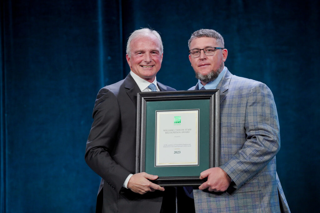 Code Council CEO, Dominic Sims, presenting the William J. Tangye award to Will Utsey