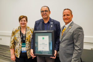 Pictured is Dr. Esber Andiroglu as he accepts the 2022 PMG Leadership Award during the PMG Membership Council Meeting on Wednesday, Sept. 14, 2022, in Louisville, Kentucky.