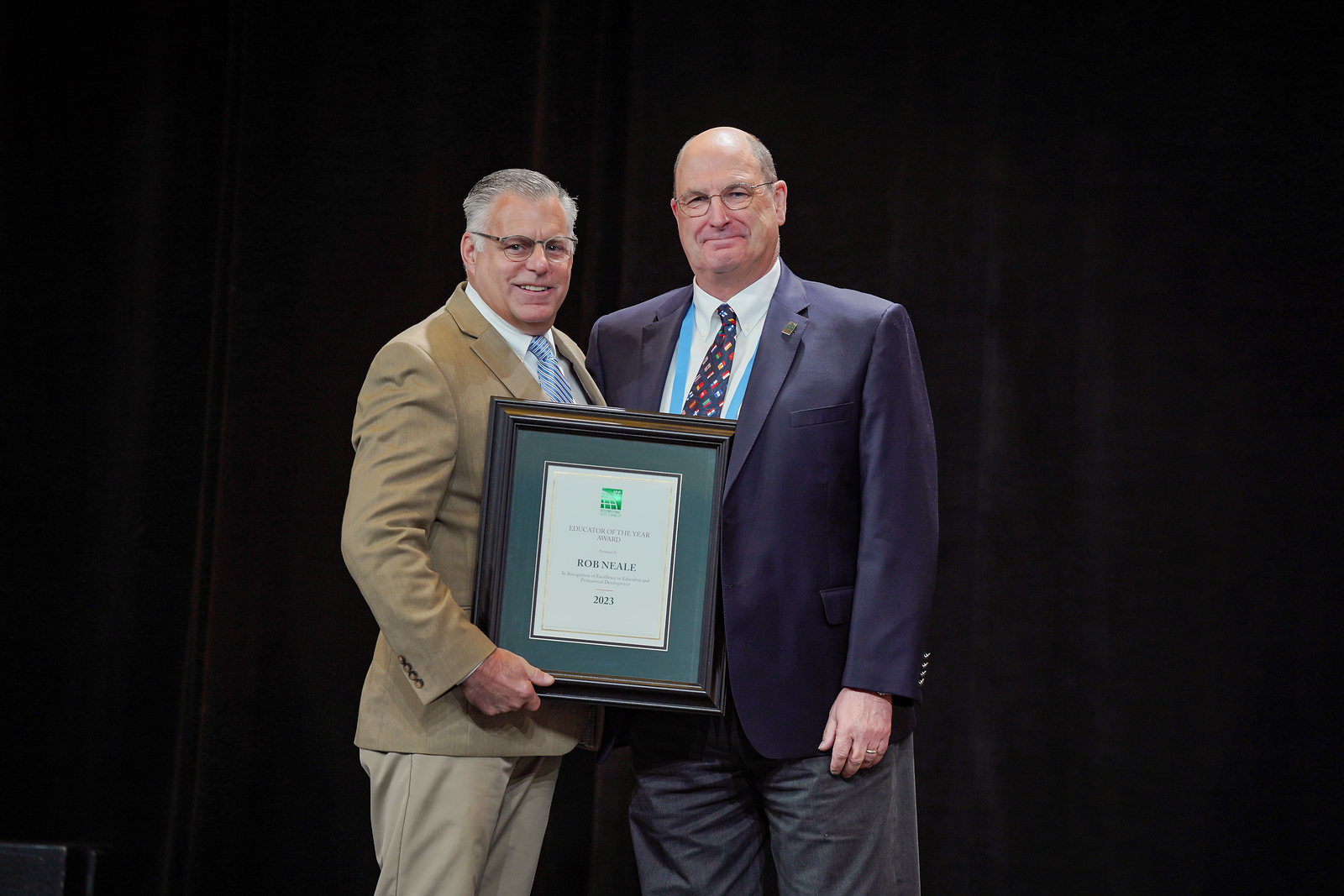 Rob Neale receiving the 2023 Educator of the Year Award